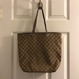 Faded Gucci bag with scruffing at bottom